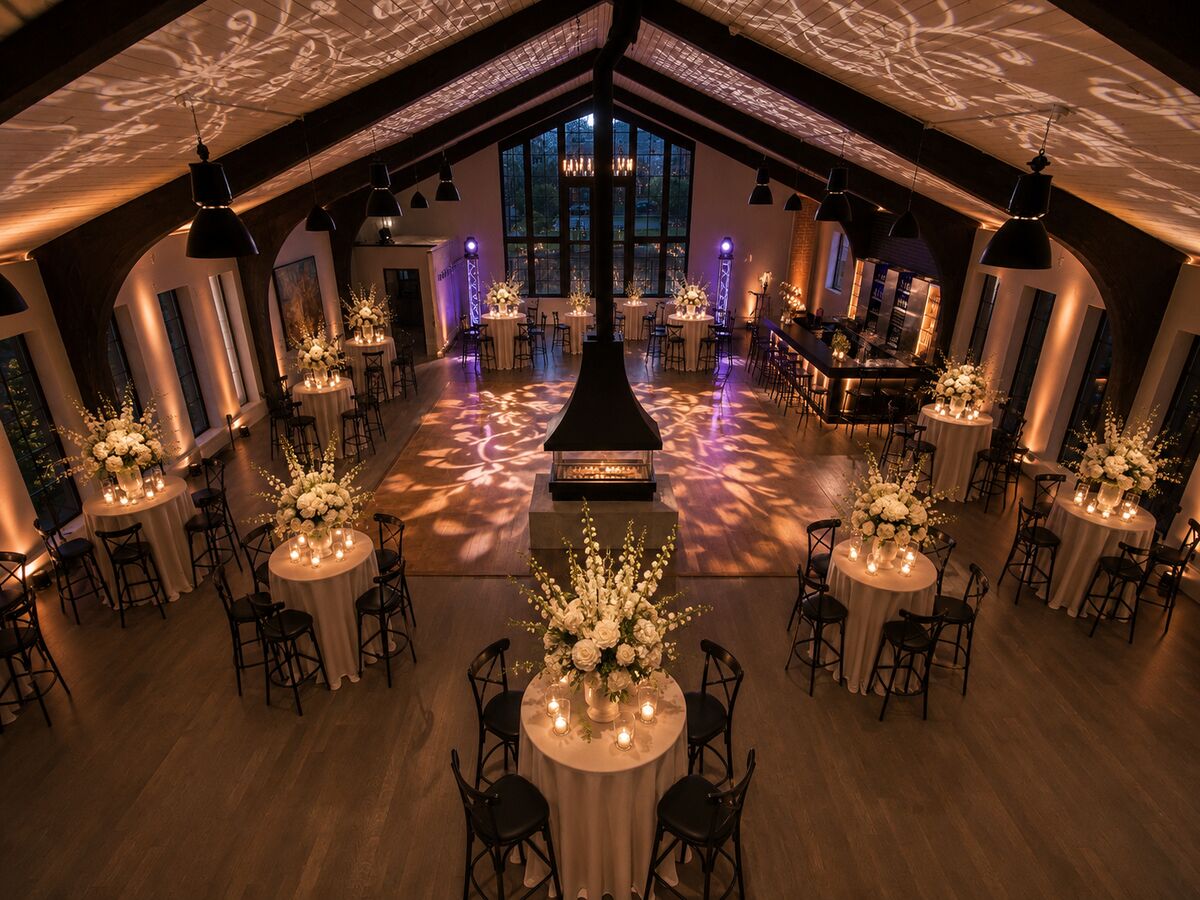 Styled wedding floor set at THE 1301 with florals, candlelight, and ceiling projections